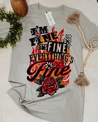 Gray t-shirt with colorful graphic design and text on a light background